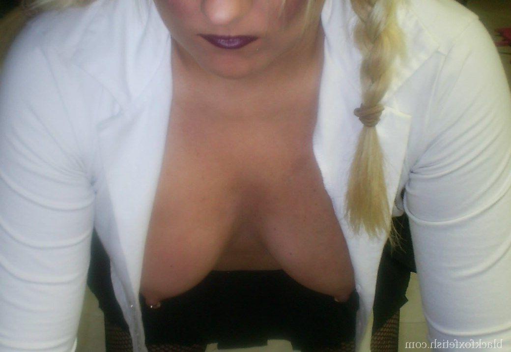 16P Blonde chick is silenced with a ball gag while showing her breasts
