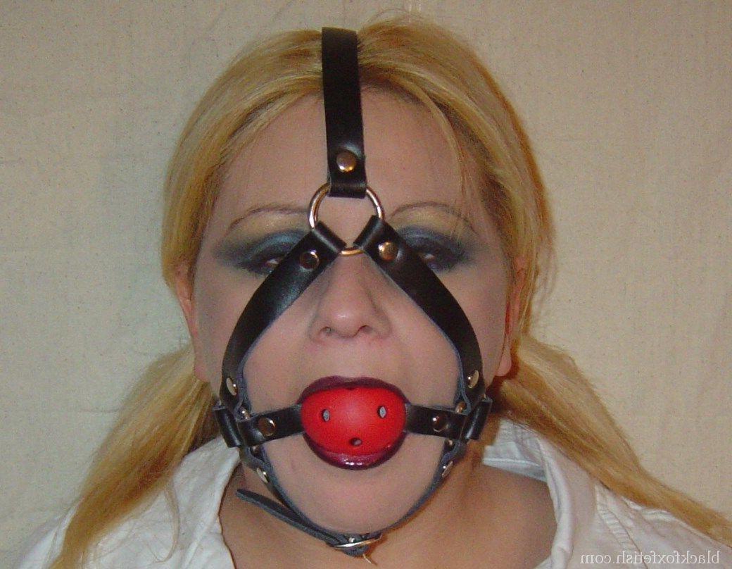 16P Blonde chick is silenced with a ball gag while showing her breasts