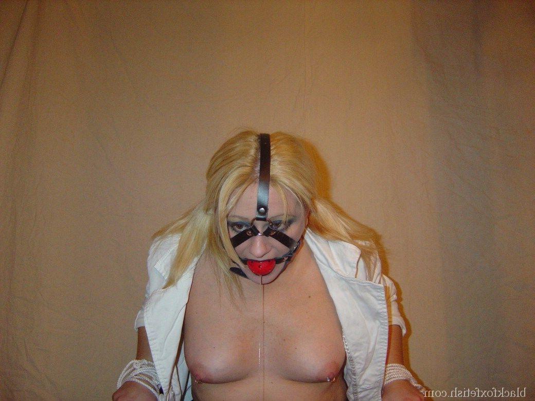 16P Blonde chick is silenced with a ball gag while showing her breasts