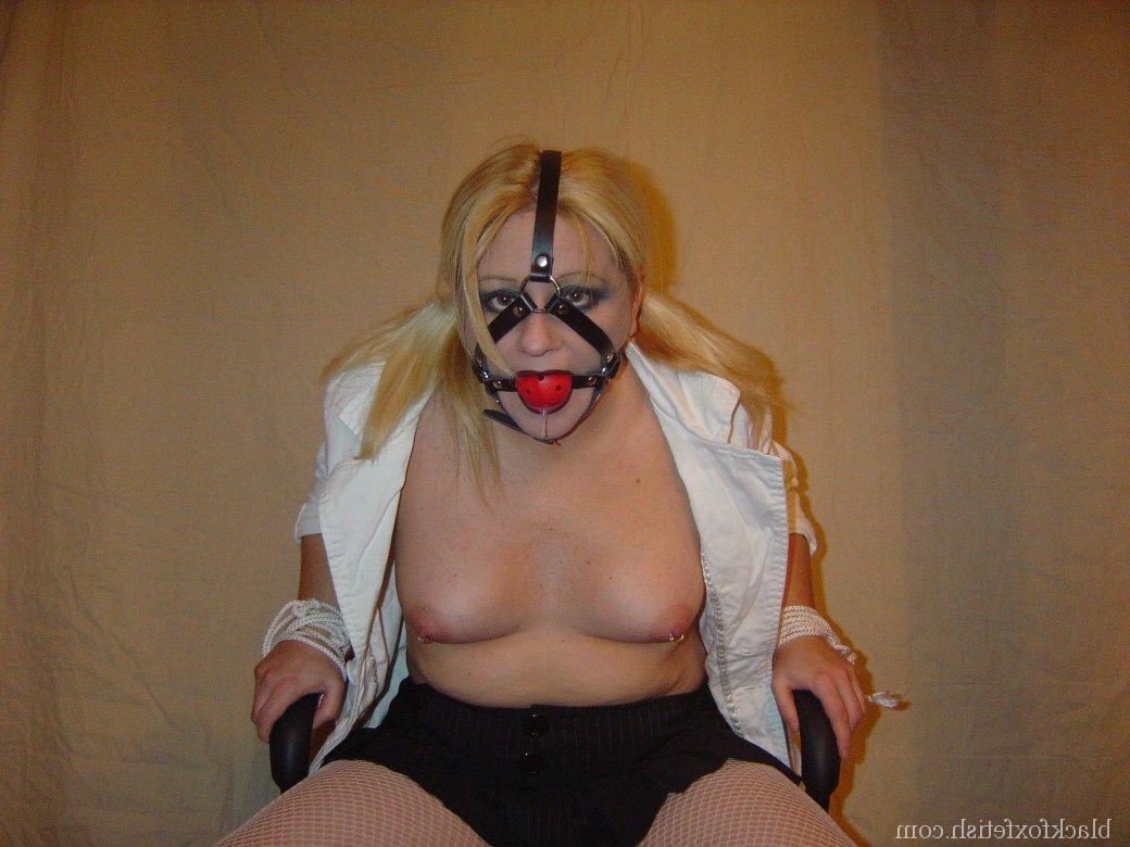 16P Blonde chick is silenced with a ball gag while showing her breasts