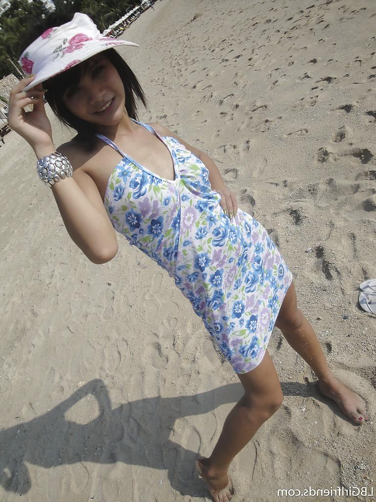 16P Cute skinny Asian tranny Mon posing outdoors and showing her cock