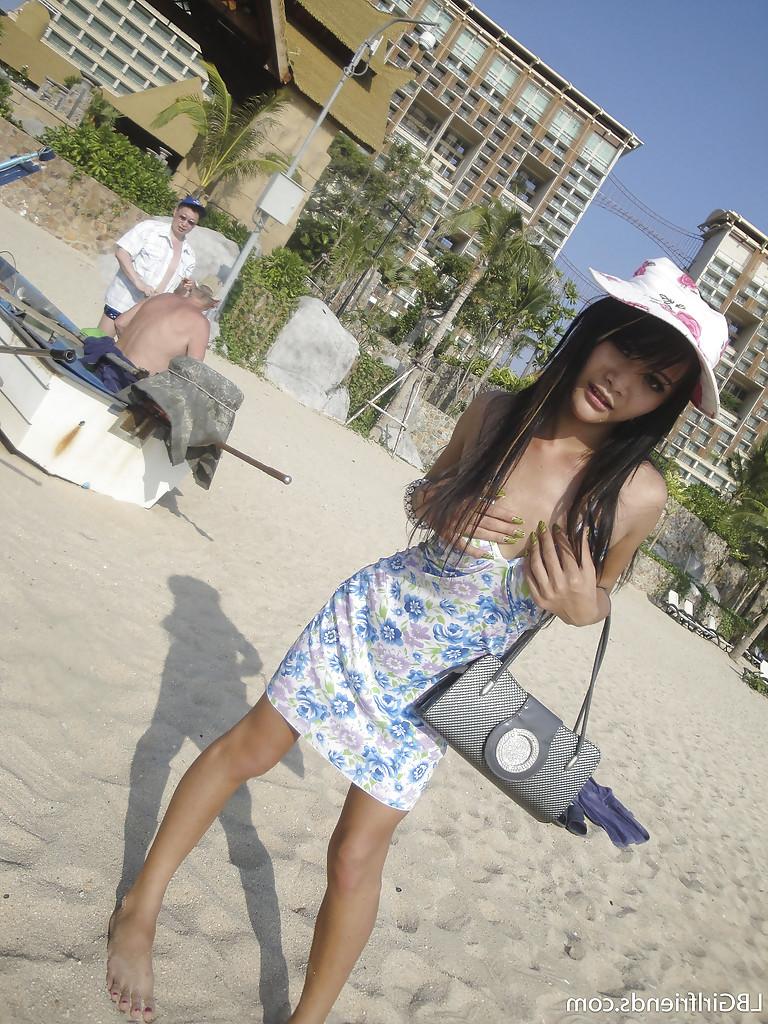 16P Cute skinny Asian tranny Mon posing outdoors and showing her cock