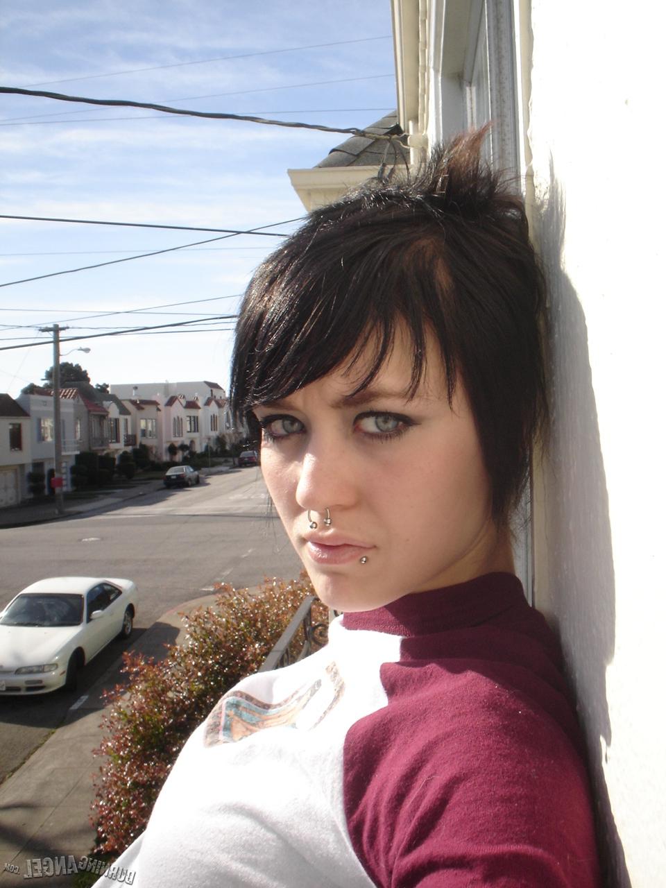 16P Short-haired punk chick with pierced nose, lip, navel in her own photos