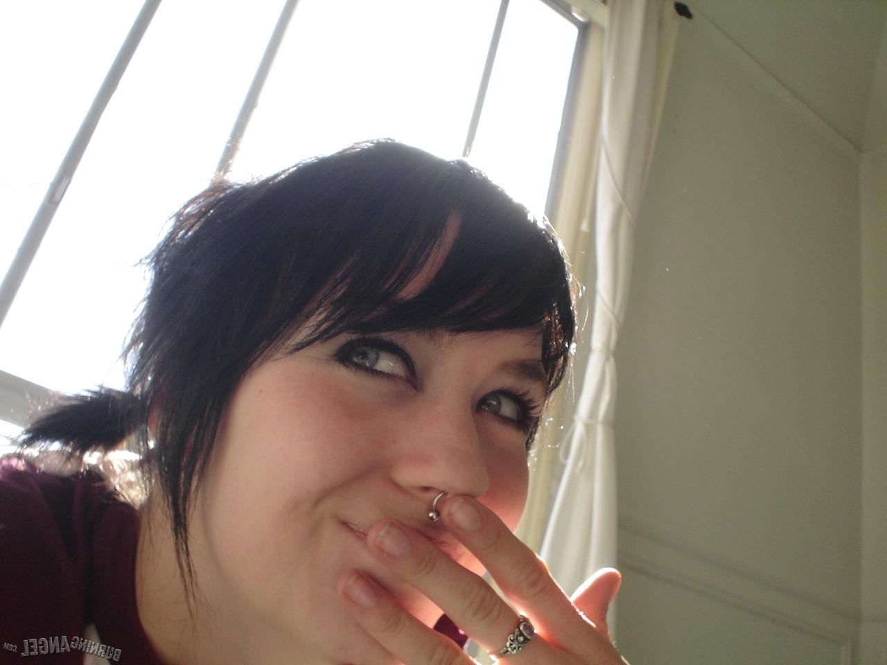 16P Short-haired punk chick with pierced nose, lip, navel in her own photos
