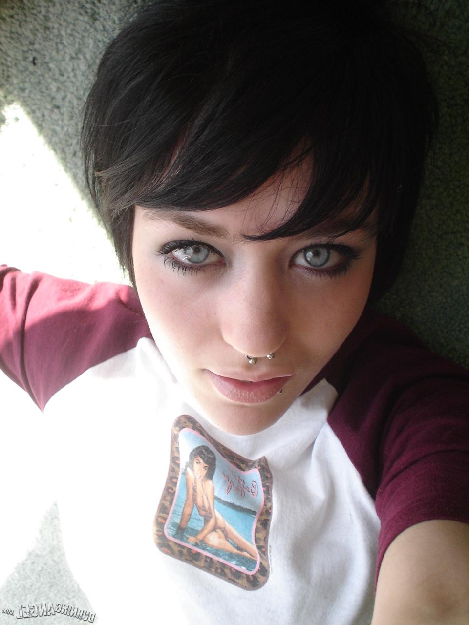 16P Short-haired punk chick with pierced nose, lip, navel in her own photos