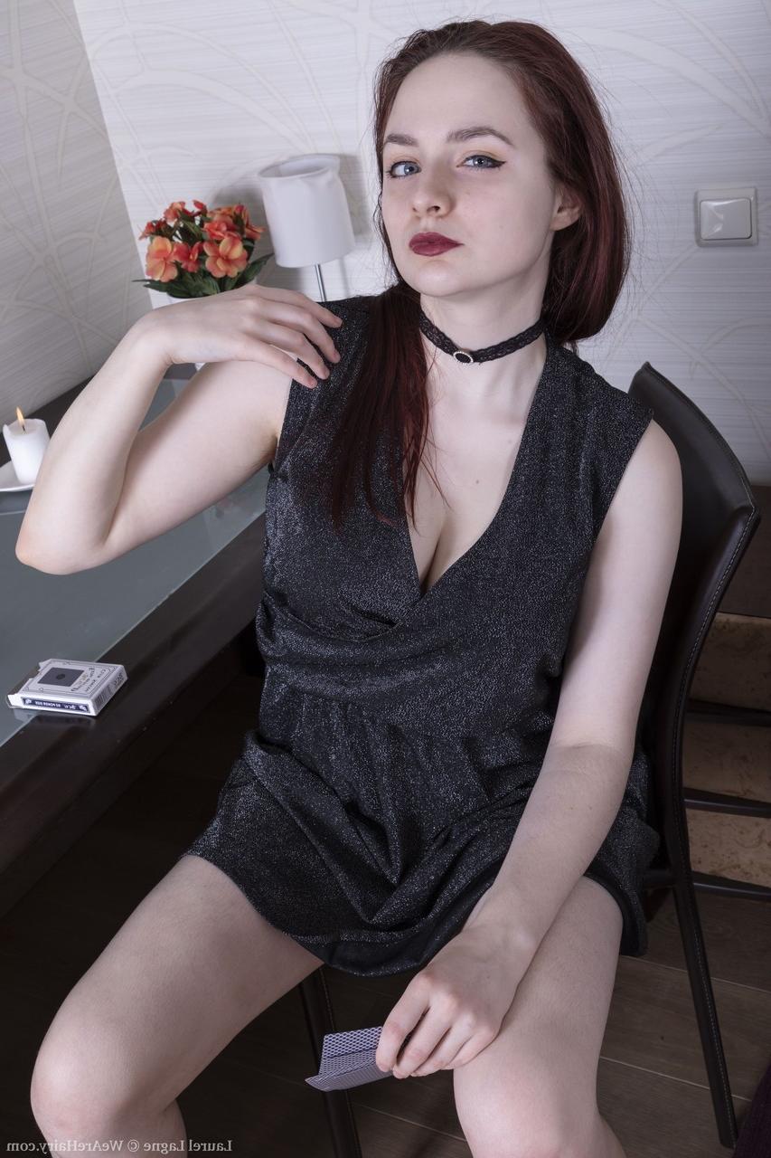 20P Hot ginger Laurel Lagne undresses and exposes her big boobs and furry coochie