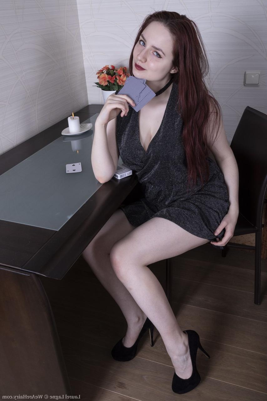 20P Hot ginger Laurel Lagne undresses and exposes her big boobs and furry coochie