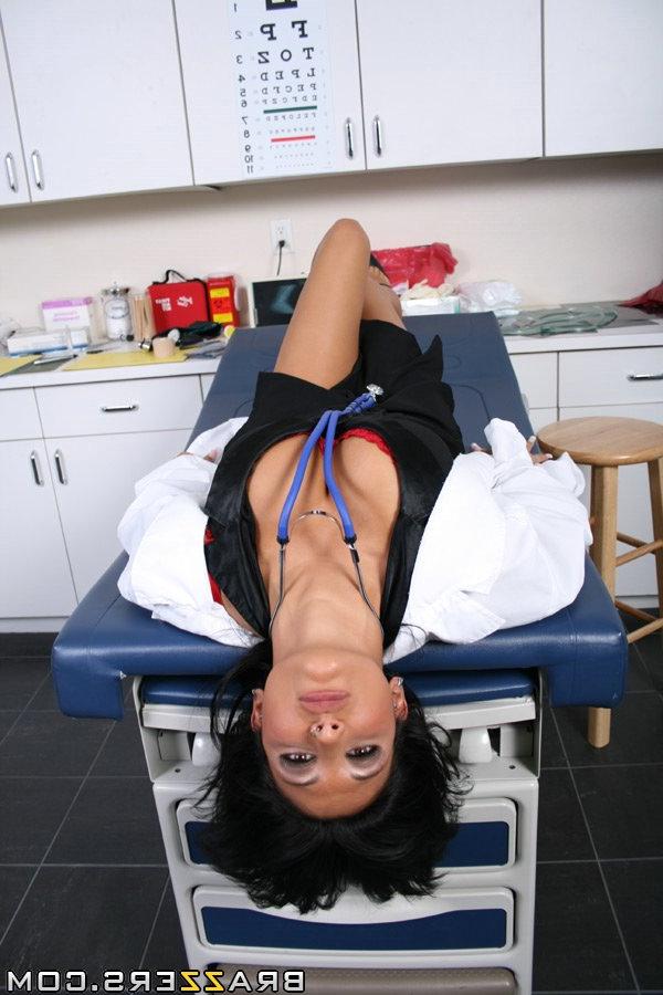 20P Stunning MILF doctor Ricki Raxxx slowly exposes her big tits and poses at work