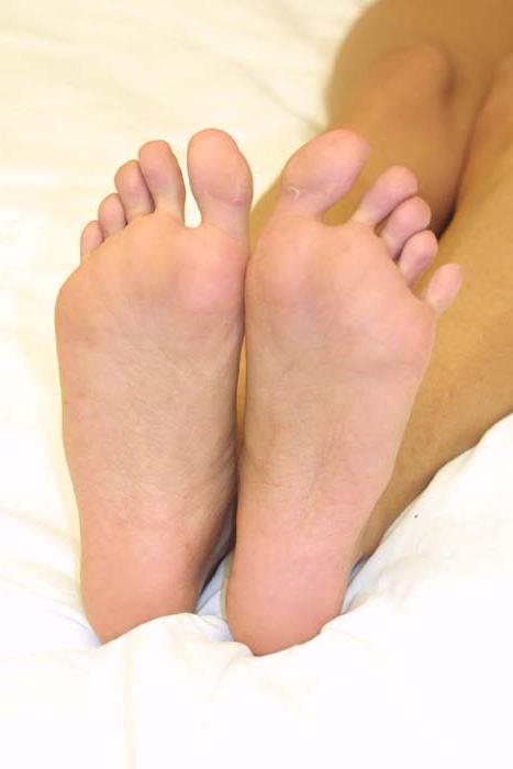 20P Dark-haired mature Janet Taylor unveils her big tits and teases with her feet