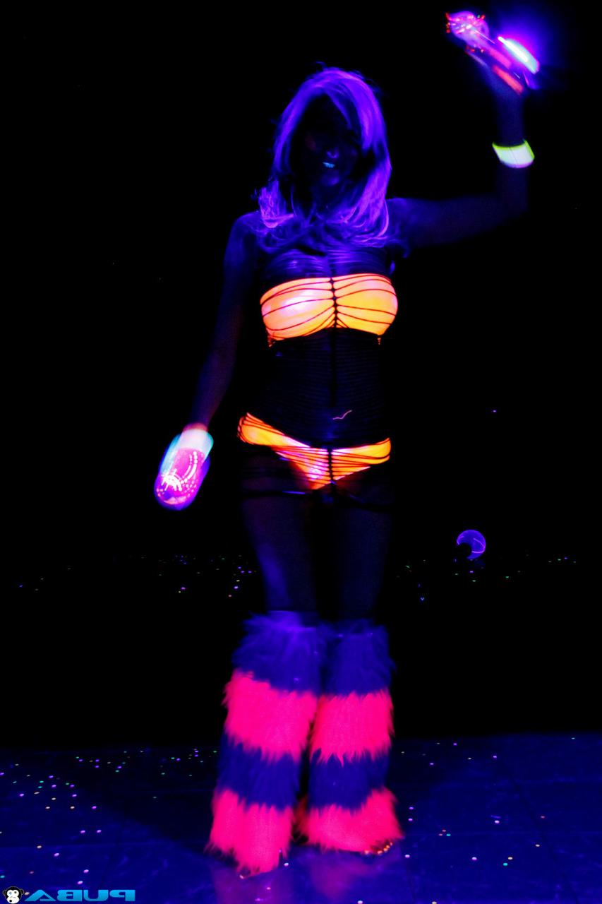 20P Huge boobed French MILF posing in her slutwear under the flashing lights