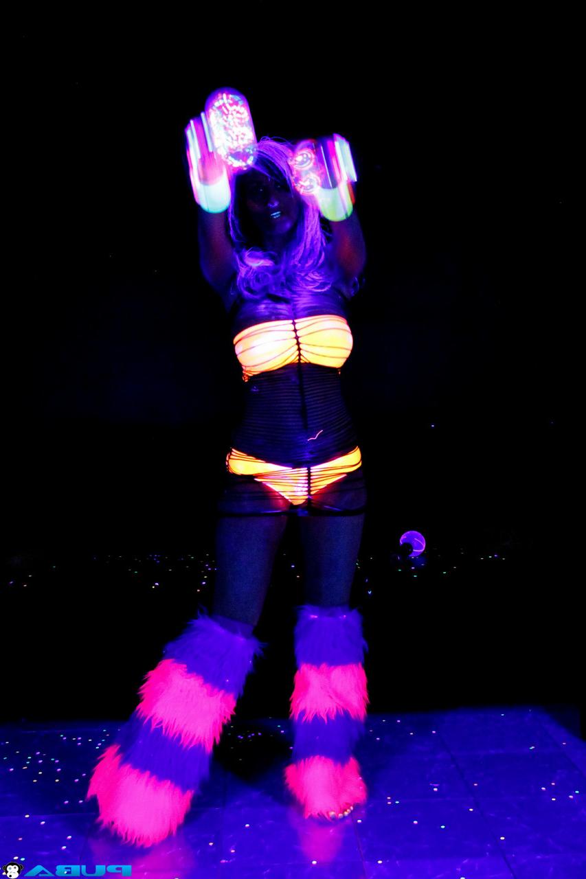 20P Huge boobed French MILF posing in her slutwear under the flashing lights