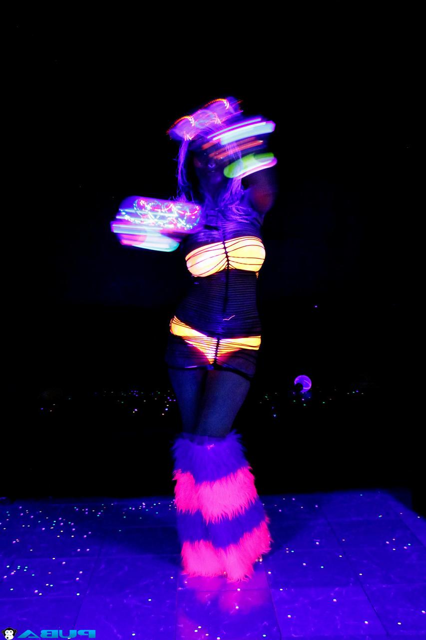 20P Huge boobed French MILF posing in her slutwear under the flashing lights