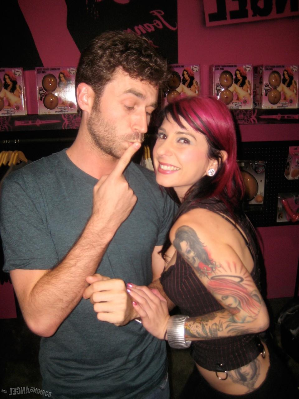 15P Clothed females with tattoos flash their butts while at a party