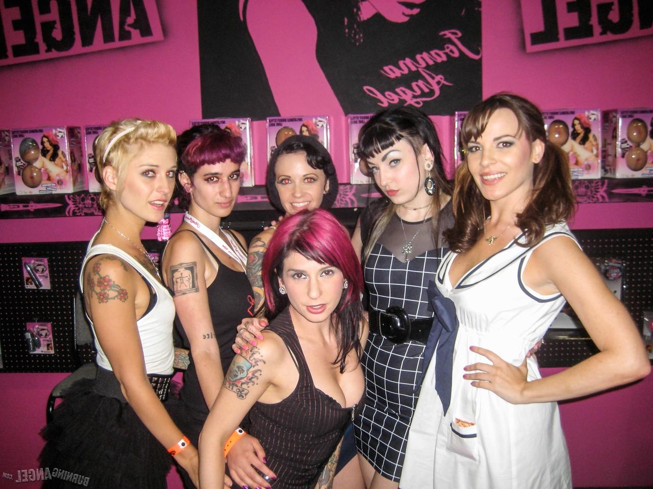 15P Clothed females with tattoos flash their butts while at a party