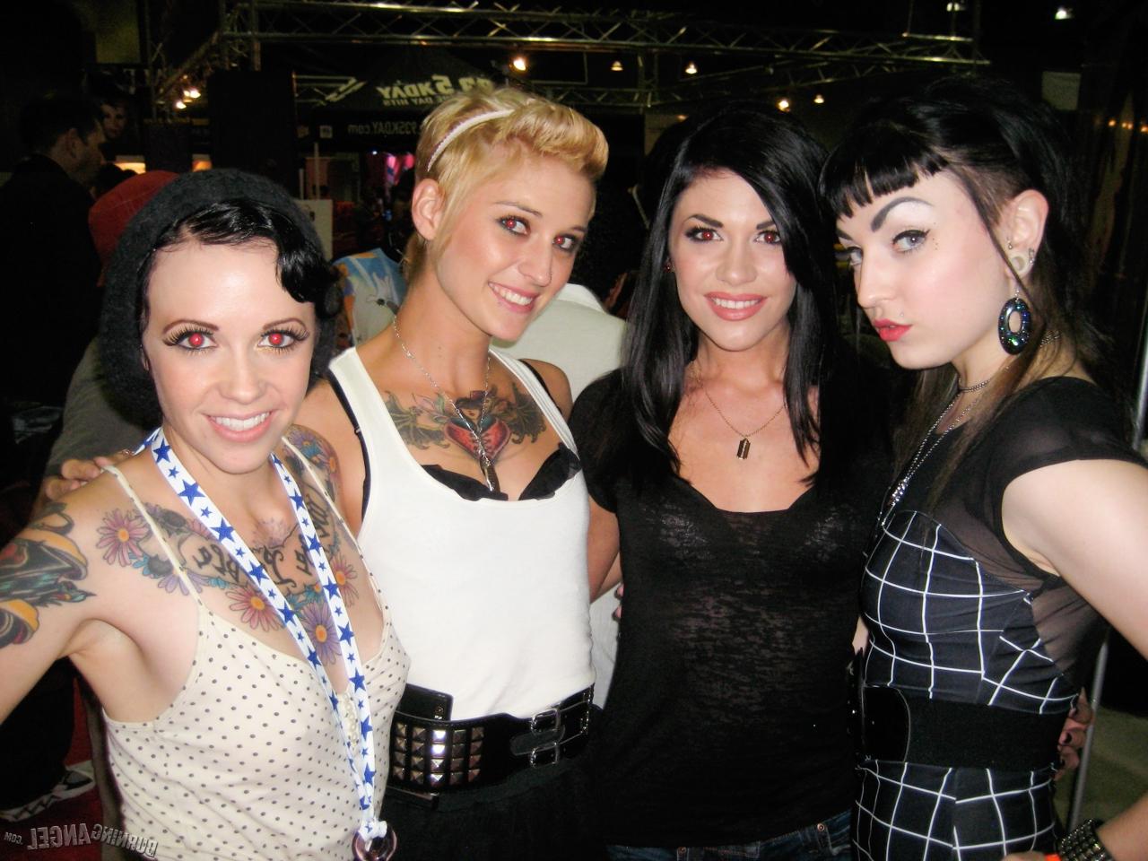 15P Clothed females with tattoos flash their butts while at a party