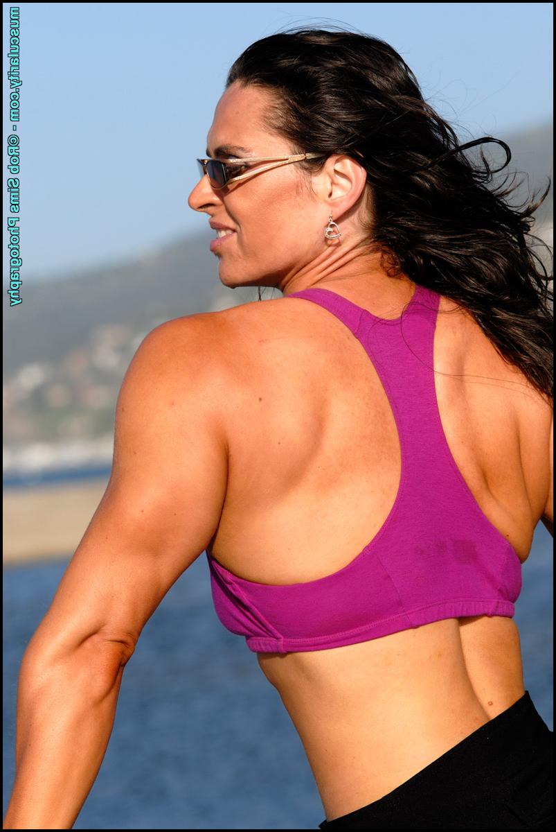 15P Brunette bodybuilder Lada Phihalova flexes in bare feet while on a beach