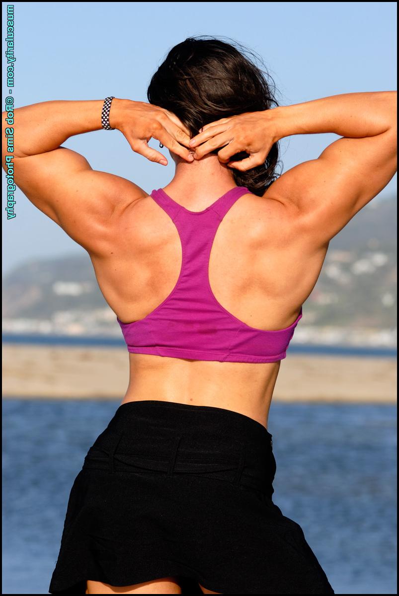 15P Brunette bodybuilder Lada Phihalova flexes in bare feet while on a beach