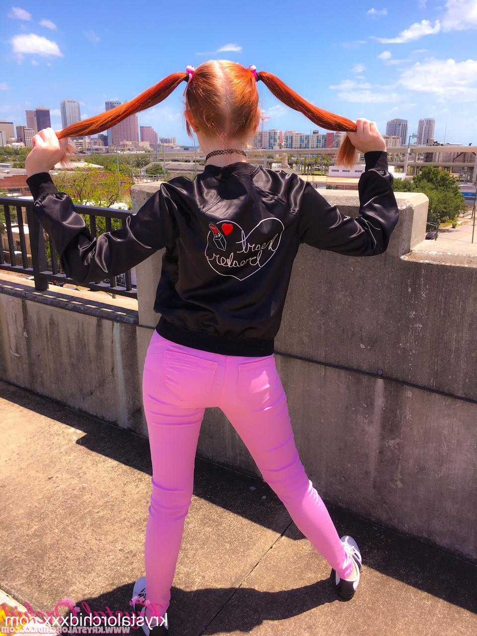15P Pig-tailed babe Krystal Orchid exposing her tiny tits & her tight ass outdoors