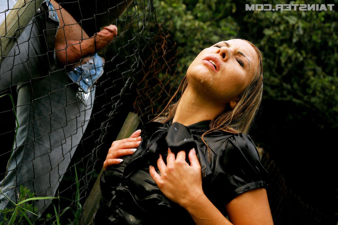 15P Clothed girl gets peed on after sucking off a cock thru a wire fence