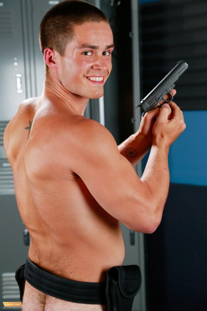 20P Naughty policeman Jordan Evans teases with his guns in a kinky striptease