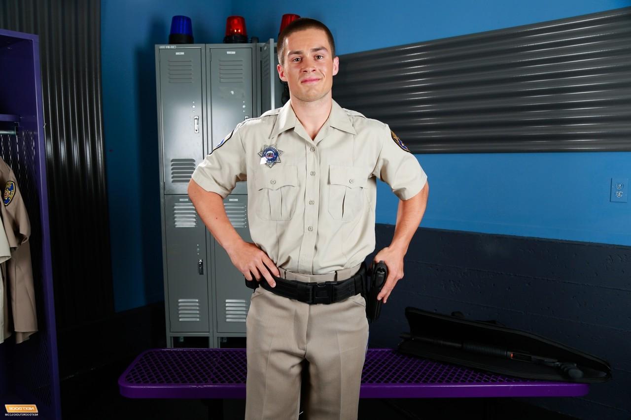 20P Naughty policeman Jordan Evans teases with his guns in a kinky striptease