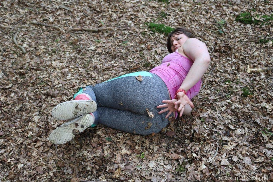 16P Caucasian girl is hogtied and gagged in her clothes upon dried leaves