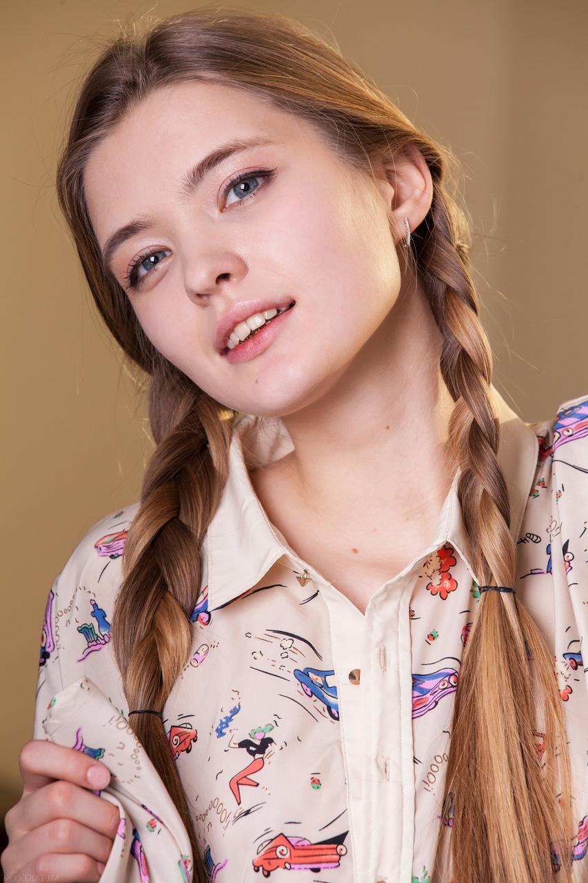 20P Pretty teen with pigtails Sigrid exposes her delicious pussy and long legs