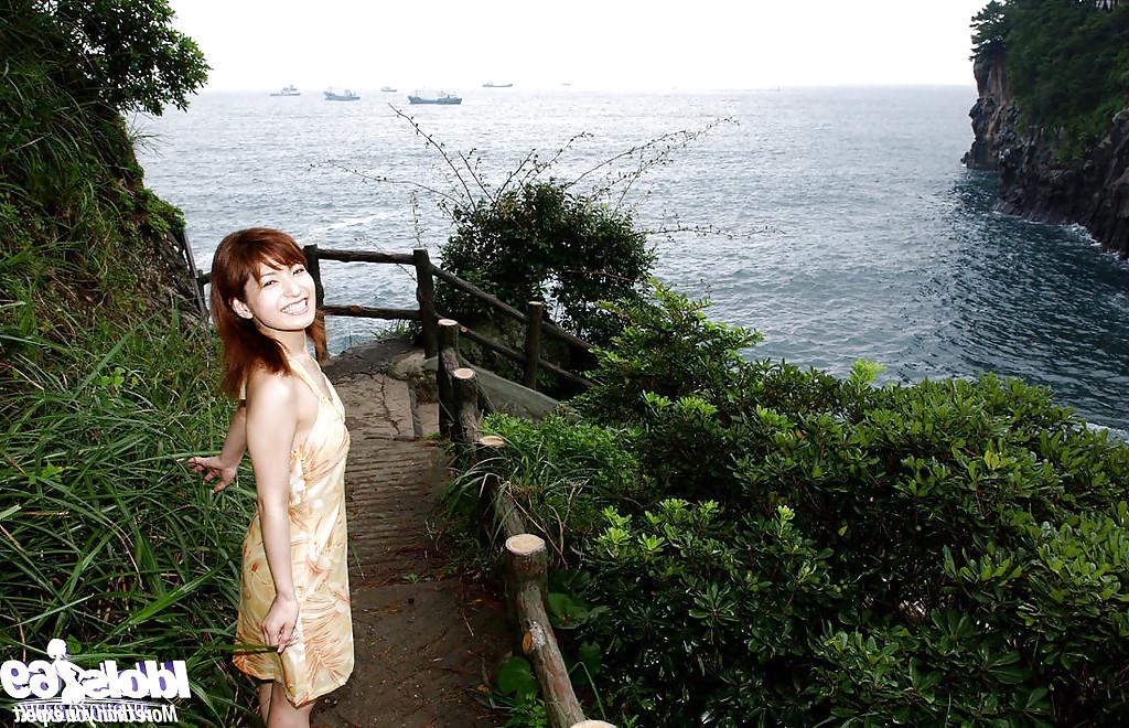 16P Redhead asian babe An Nanba stripping off her clothes outdoor