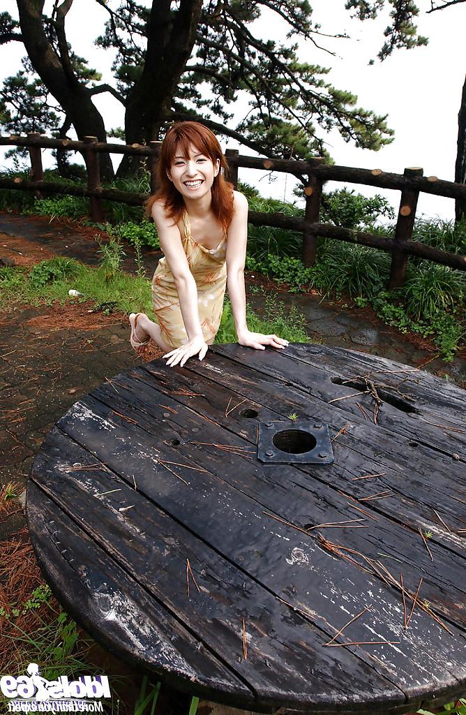 16P Redhead asian babe An Nanba stripping off her clothes outdoor