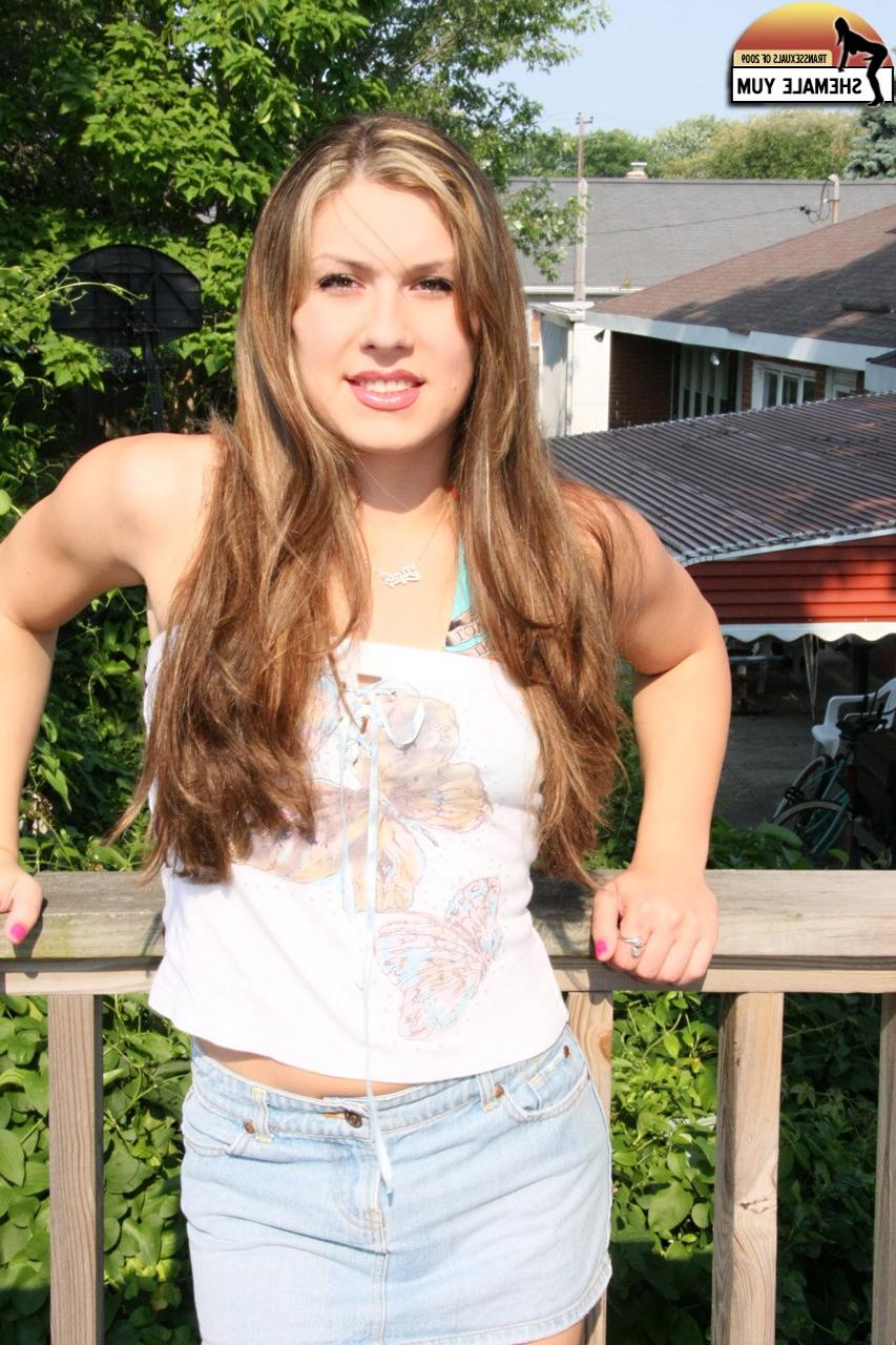 15P Long-haired shemale Chrissy Snow stripping and sunbathing on the balcony