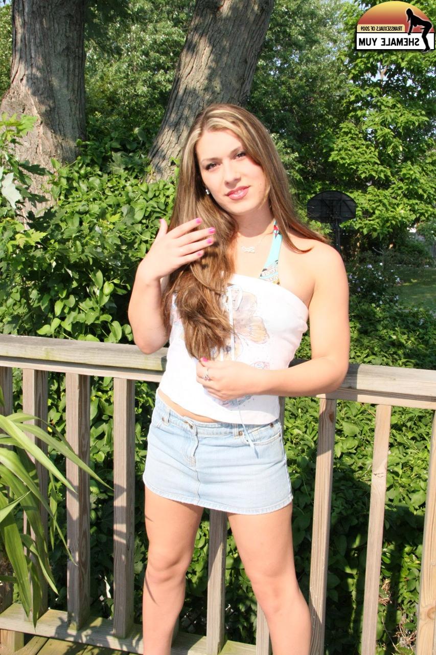 15P Long-haired shemale Chrissy Snow stripping and sunbathing on the balcony