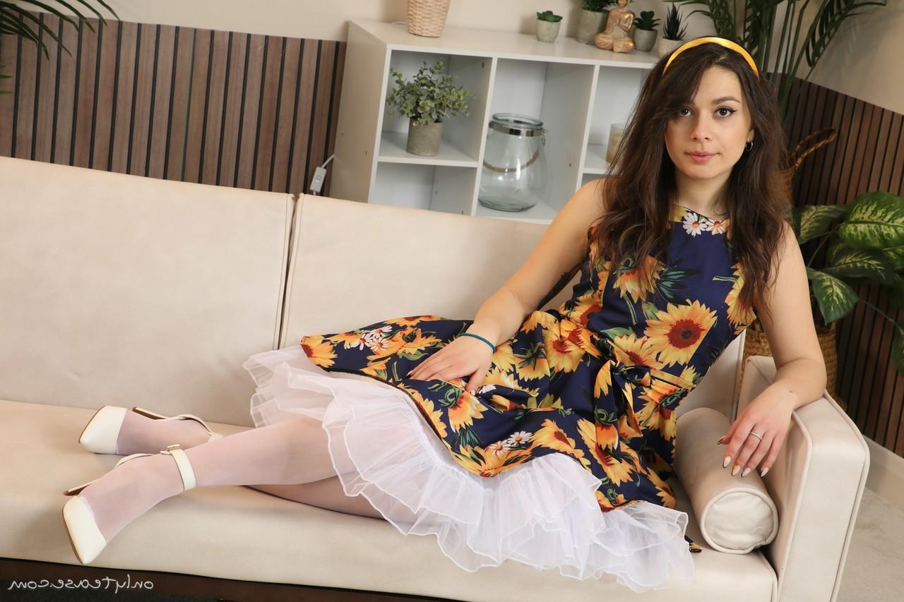 16P Pretty brunette Gia takes off a dress to go topless in white nylons