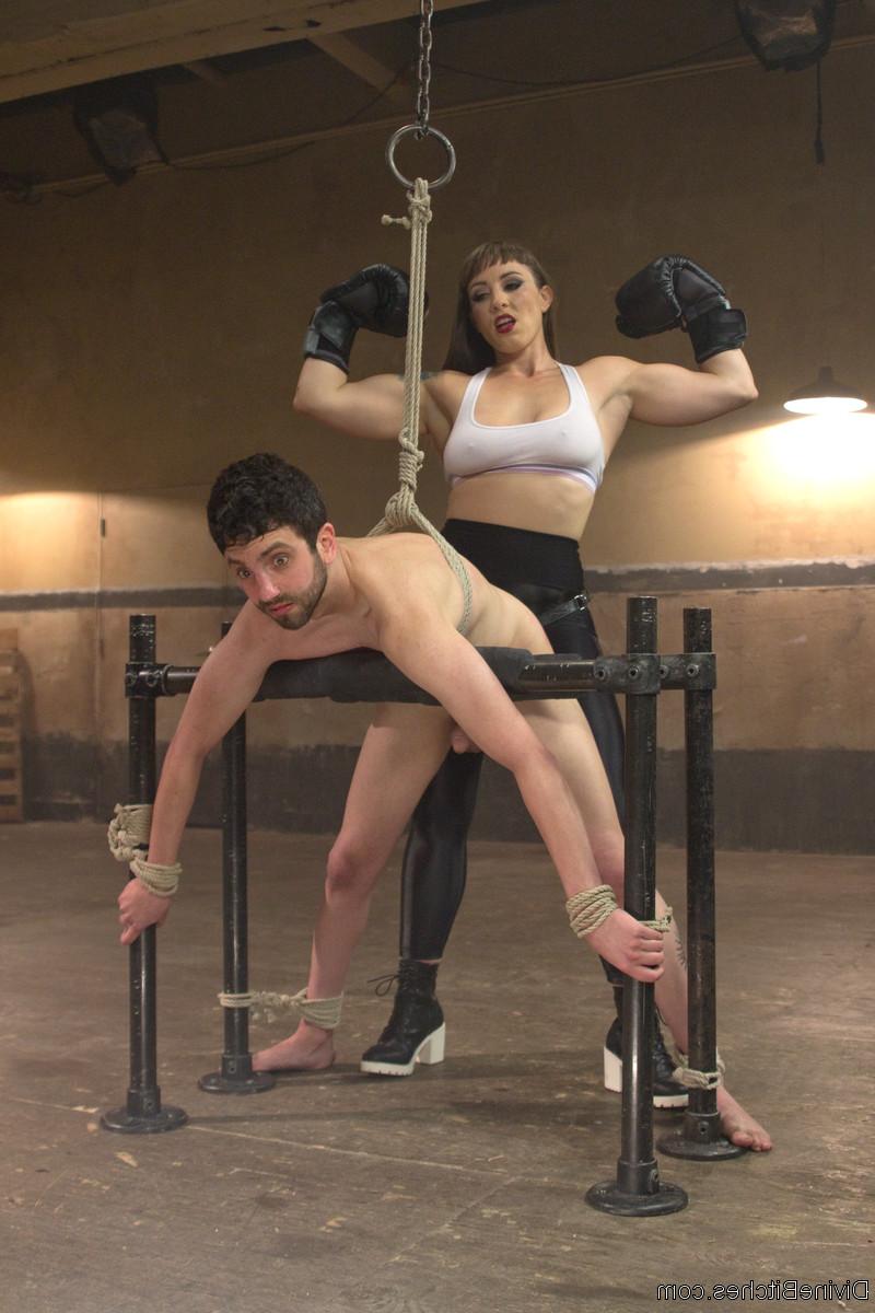 20P Stunning domme Mistress Kara sticks a black strapon in a sex slave's asshole