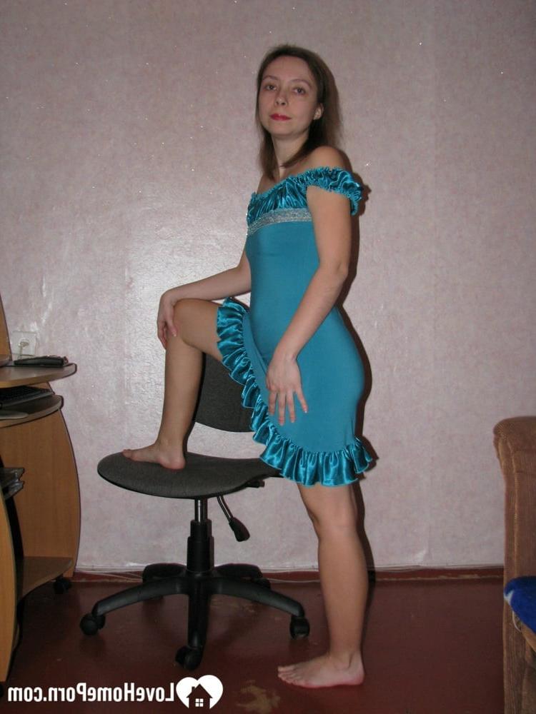 20P Brunette receptionsist strips fully naked and shows off her hairy pussy
