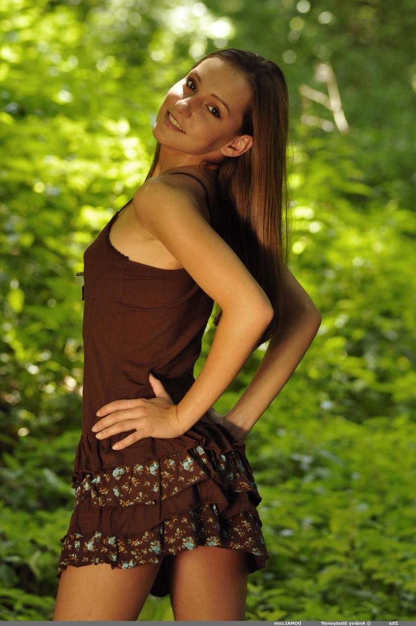 20P Hot babe Zita getting rid of her clothes and posing naked in the forest