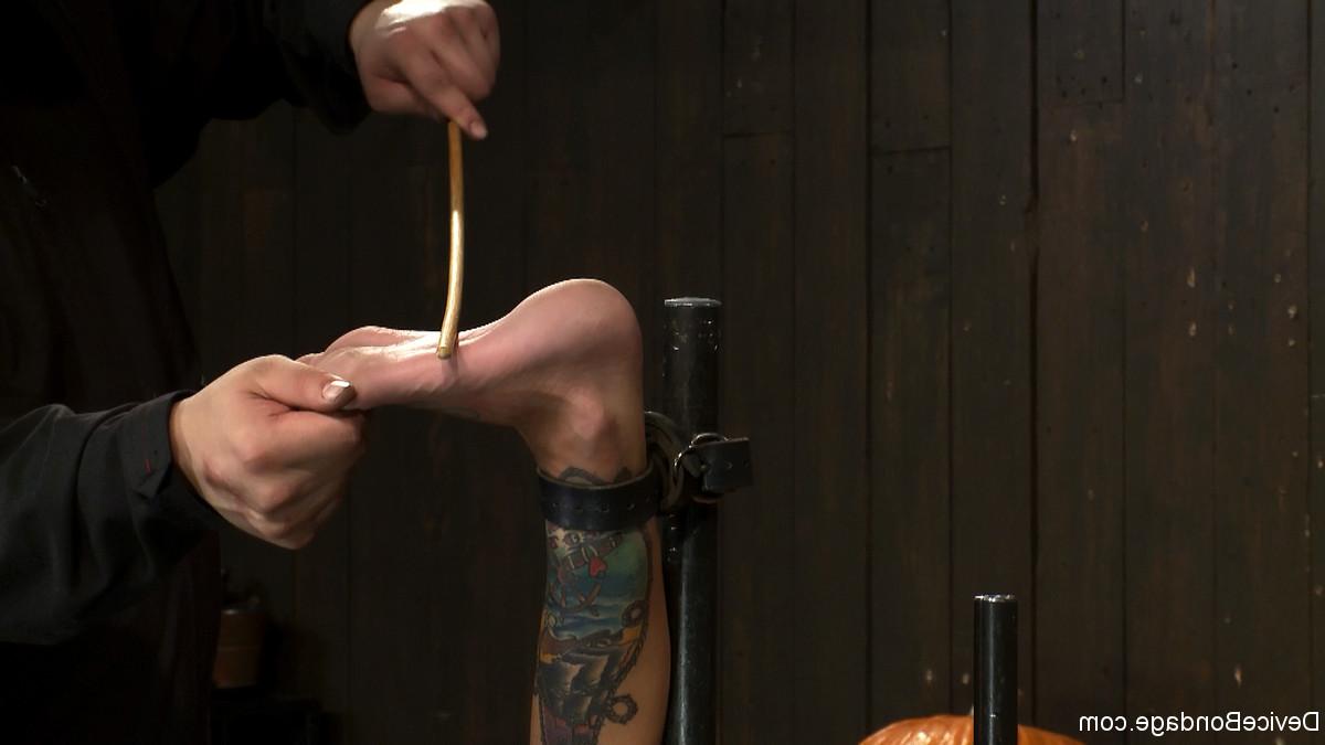 17P Latina Gia DiMarco is restrained in metal bondage & has her feet caned