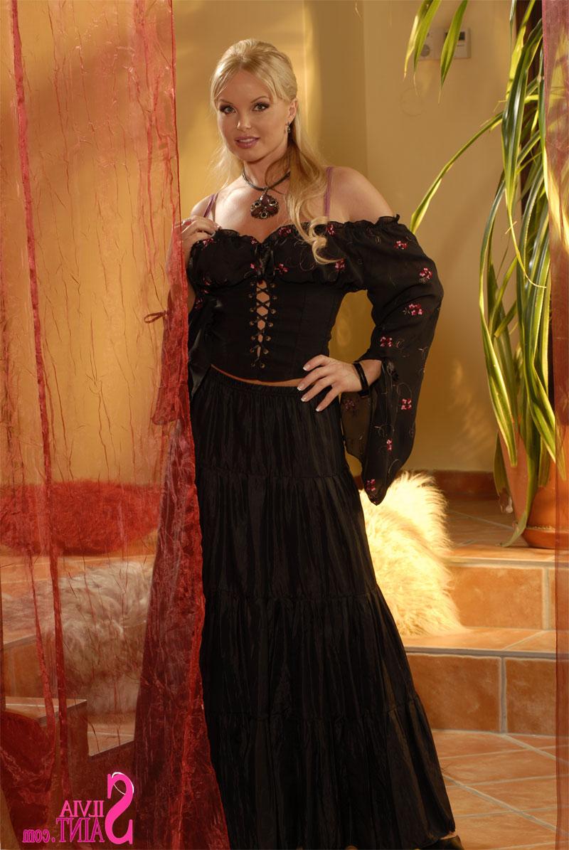 15P Beautiful MILF Silvia Saint flashes her upskirt panties in a long dress