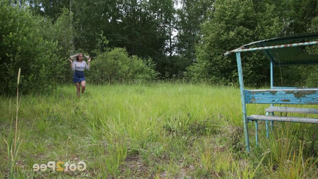 15P Aura shows her bare ass while taking a pee on a bench in the outdoors