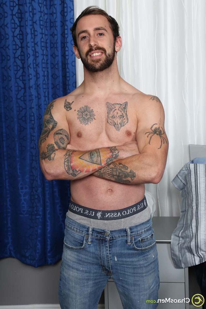 20P Gay brunette Kurt Langdon strips and shows his inked body, big ass & uncut rod