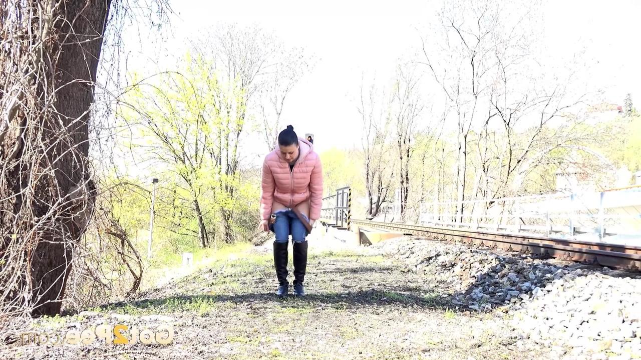15P Solo girl Billie pulls down her jeans to piss near railway tracks