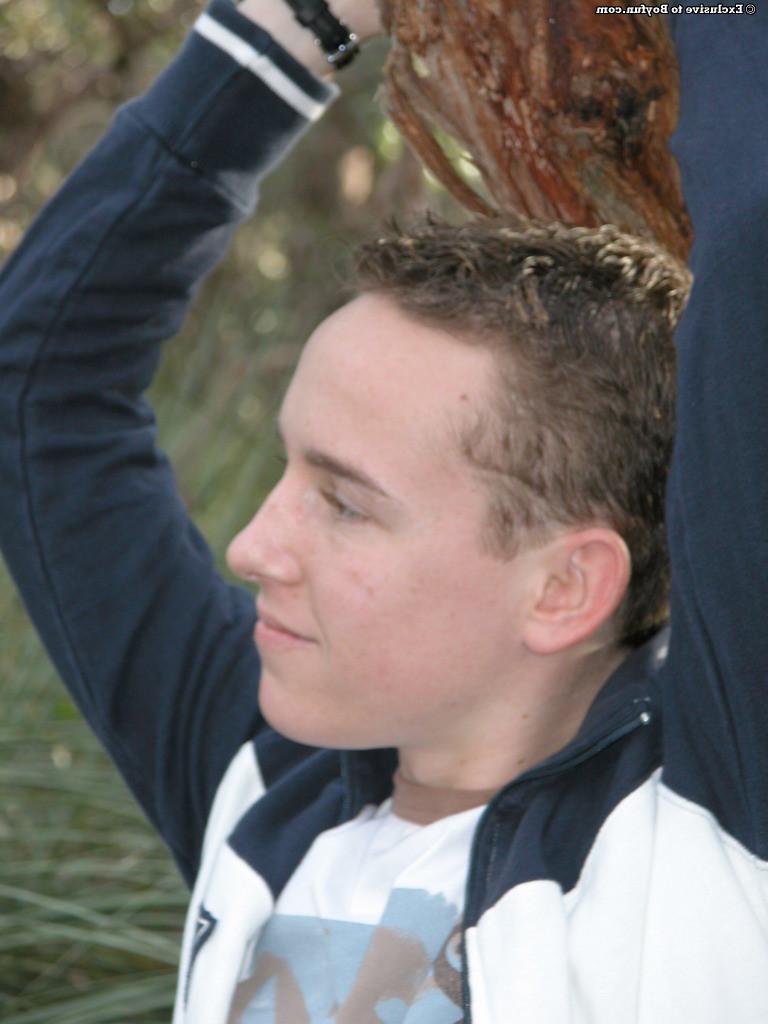 20P Petite white twink Zac undresses and poses naked against an old tree