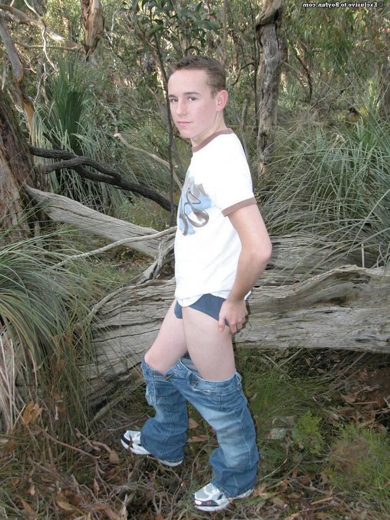 20P Petite white twink Zac undresses and poses naked against an old tree