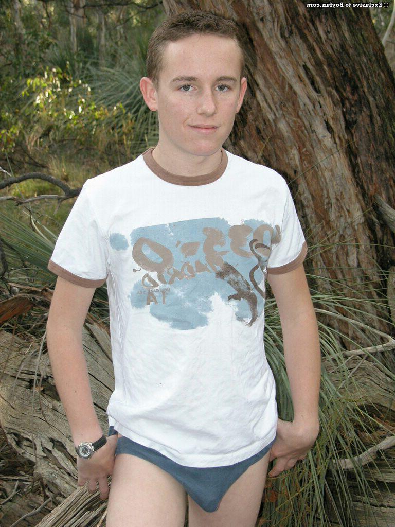 20P Petite white twink Zac undresses and poses naked against an old tree