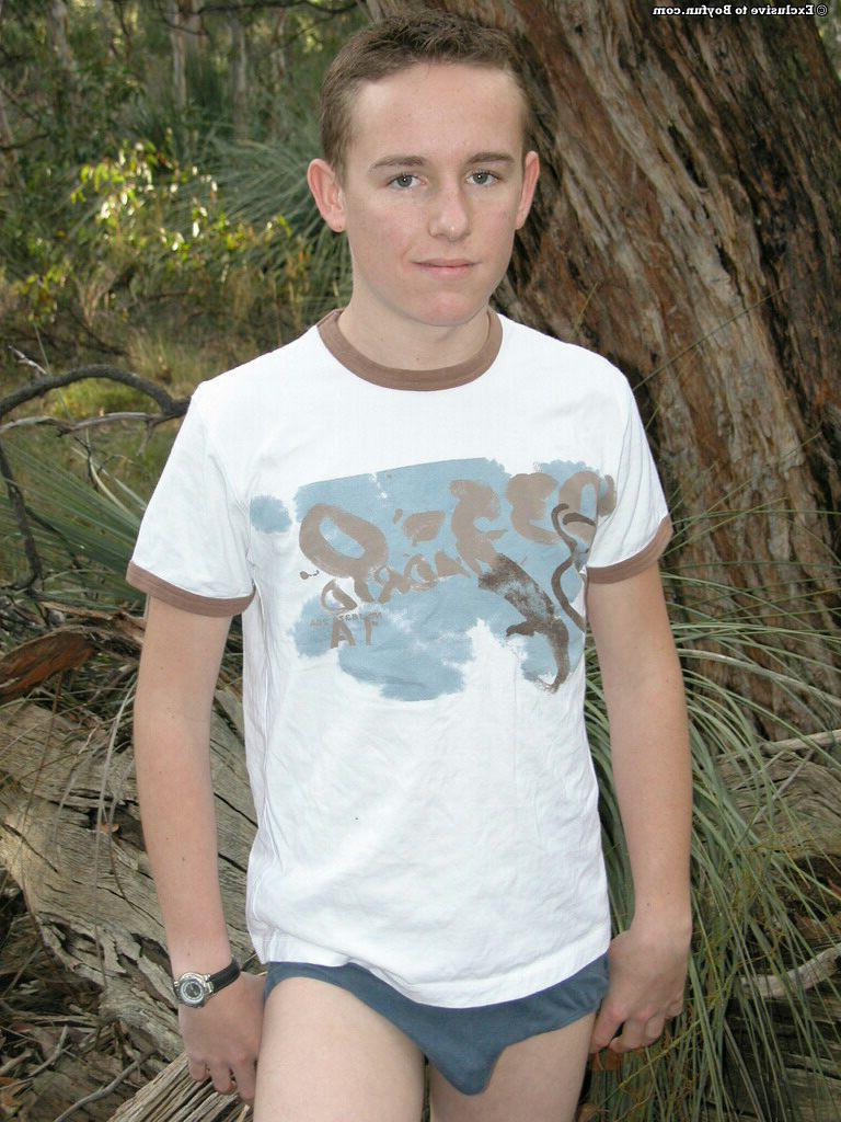 20P Petite white twink Zac undresses and poses naked against an old tree