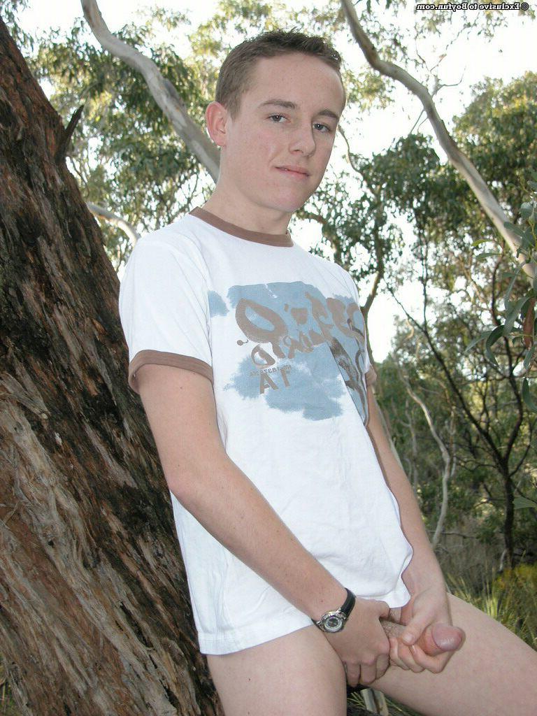 20P Petite white twink Zac undresses and poses naked against an old tree