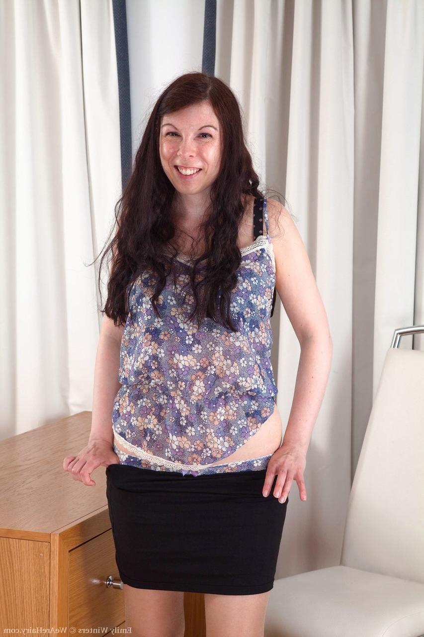 20P Slutty British secretary Emily Winters spreading her hairy muff in the office