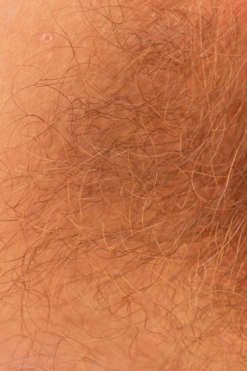 20P Short-haired brunette Mercy West showing off her hairy pussy outdoors
