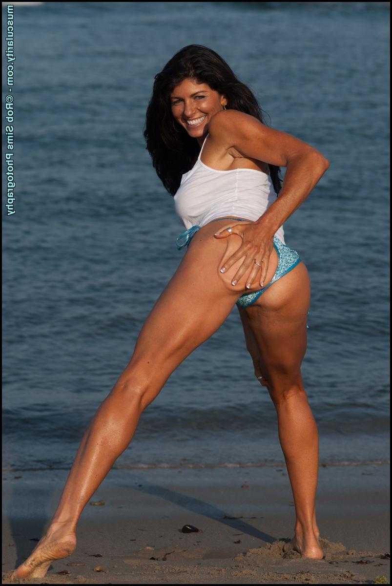 15P Brunette bodybuilder Tara Caden poses in a wet spaghetti strap shirt