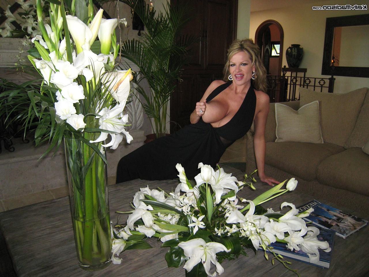 17P Incredible MILF Kelly Madison flaunts her huge knockers while on vacation