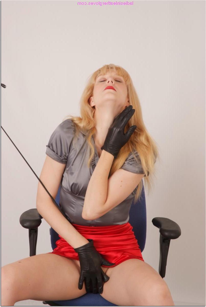15P Fair skinned woman wields a whip in leather gloves during upskirt action